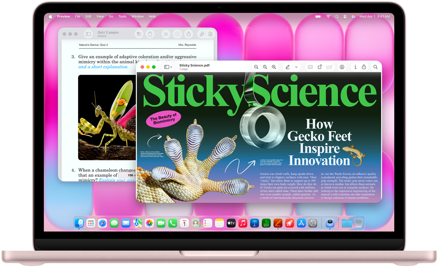 MacBook Neo rosé affichant un magazine et un document de travail